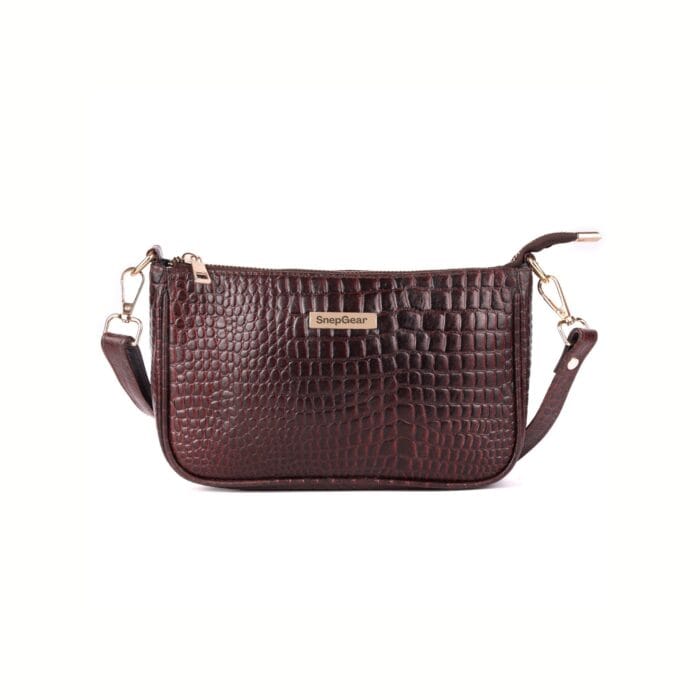 a brown leather purse with gold handles